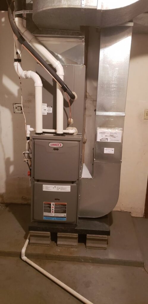 A Lennox furnace and ductwork system installed in a basement by Preferred Heating & Air in Bismarck, ND.