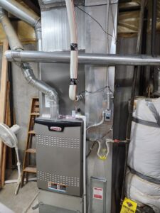 A Lennox furnace and extensive ductwork installed in a basement by D & D Heating & Air in Brighton, CO.