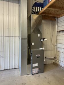 A Lennox furnace and ductwork installed in a garage or utility space by Great Plains Heating & Air in Goddard, KS.
