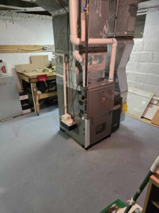 A Lennox furnace and HVAC system installed in a utility room by FH heating and cooling in Elizabeth, NJ.
