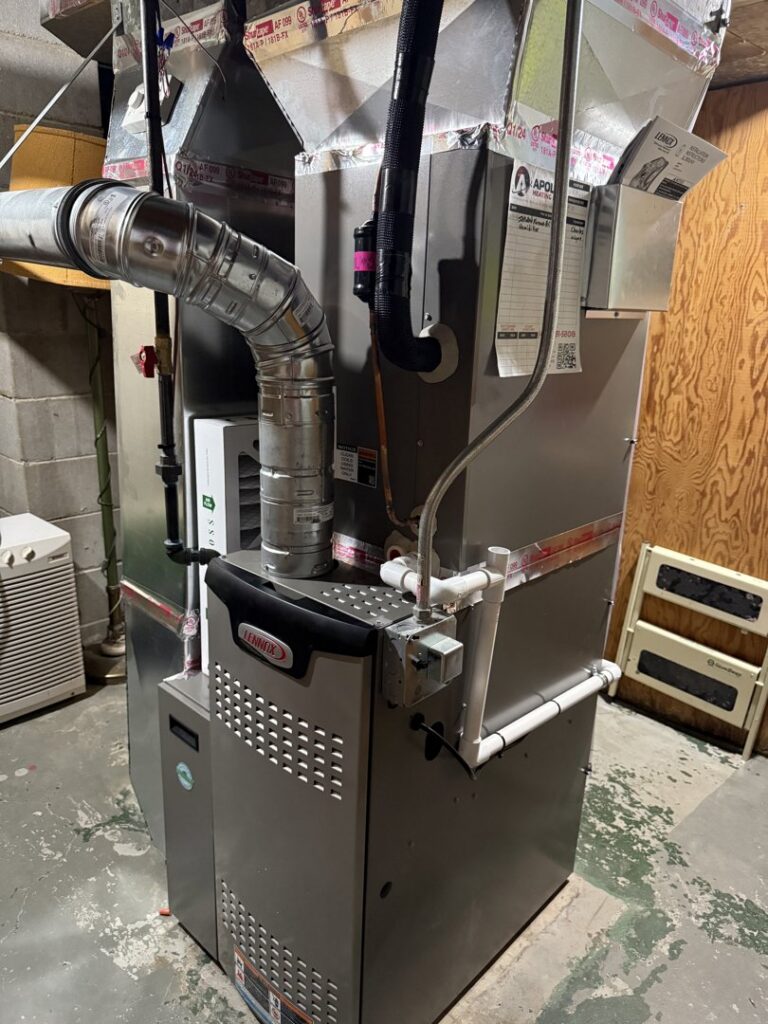 A newly installed Lennox furnace and ductwork in a basement by Apollo Heating and Air in Bellevue, NE.