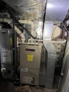 A Lennox furnace and air handler unit with ductwork installed in a basement by DND Mechanical in Columbus, OH.