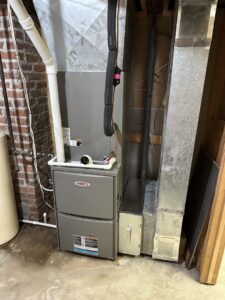 A Lennox furnace and ductwork installed in a basement by Great Plains Heating & Air in Goddard, KS.