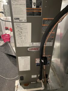 Close-up of a Lennox furnace installation showing piping and wiring by Cyber Heating and Cooling in Bloomington, MN.