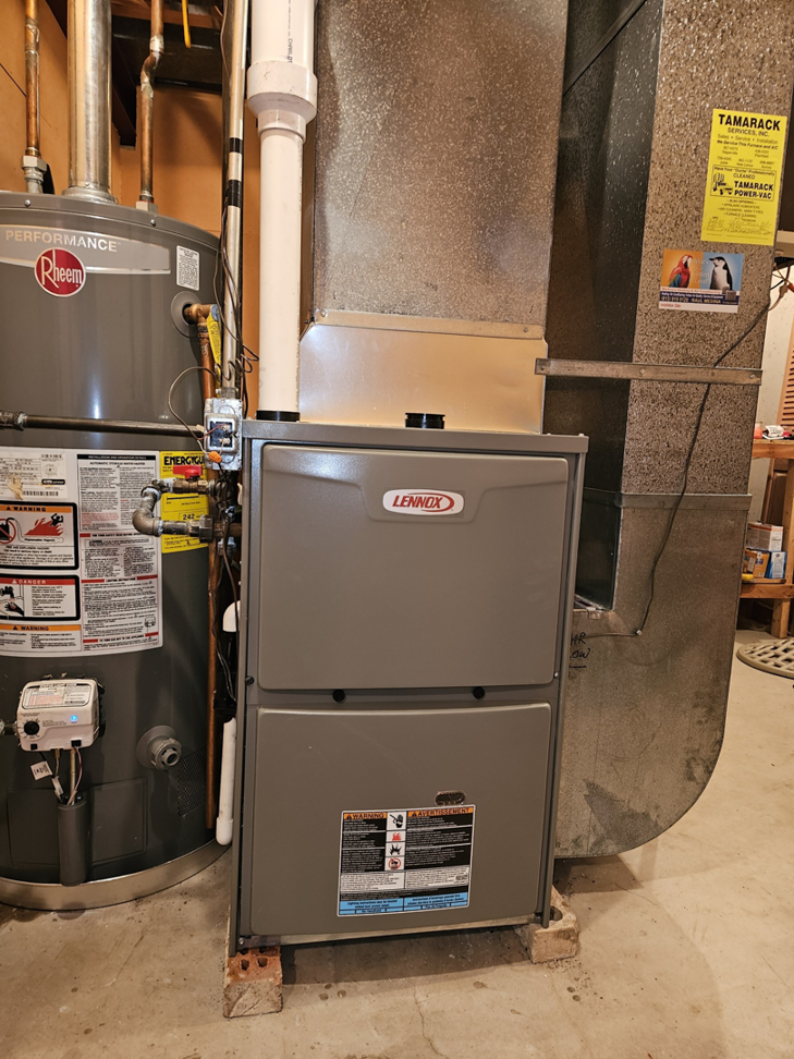A newly installed Lennox furnace and Rheem water heater by Medina's Heating & Air Conditioning in Joliet, IL.