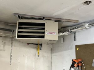 A Lennox garage heater professionally installed on a ceiling by HeatSource Mechanical in Wasilla, AK.