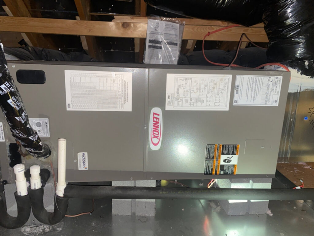 A Lennox HVAC air handler unit installed in an attic by Subzero Mechanical LLC Heating & Air in Concord, NC.