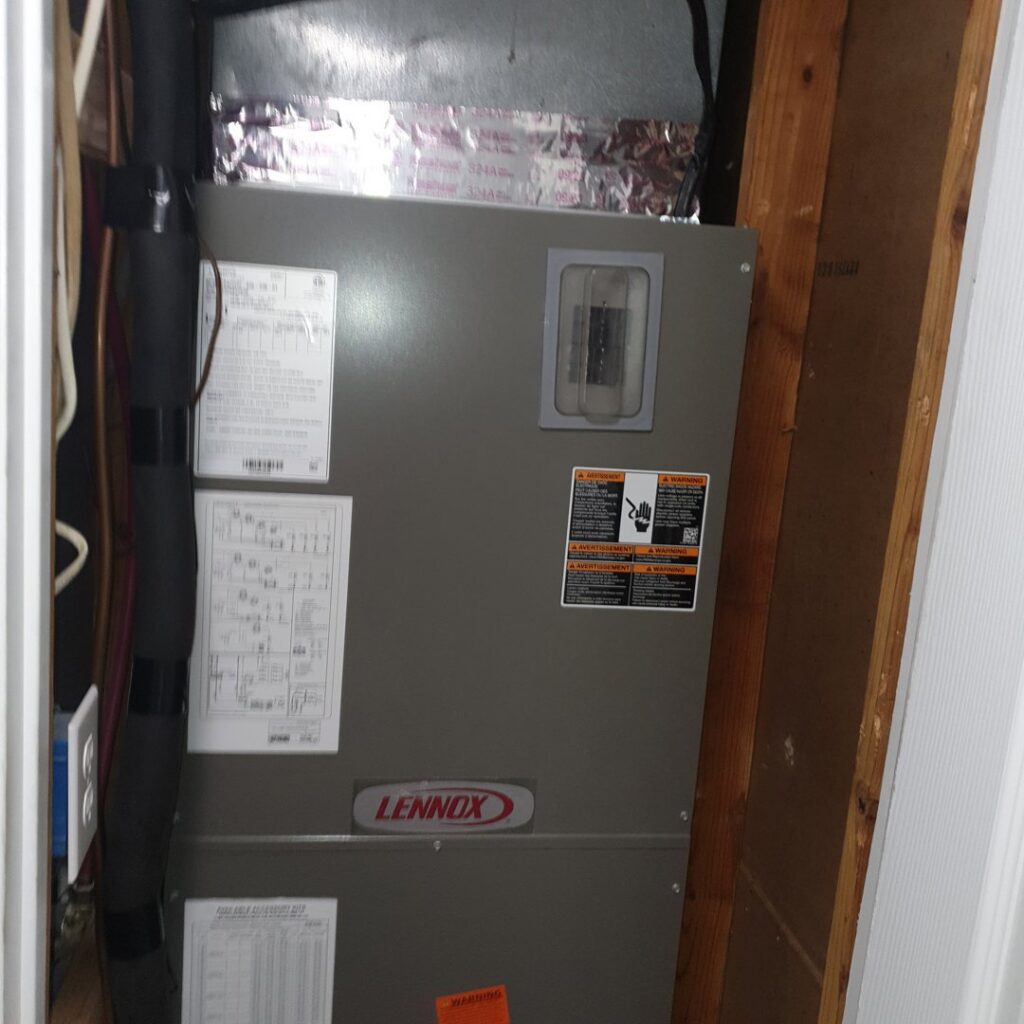 A Lennox HVAC air handler unit installed in a utility closet by Home Shield Heating and Air in Shreveport, LA.