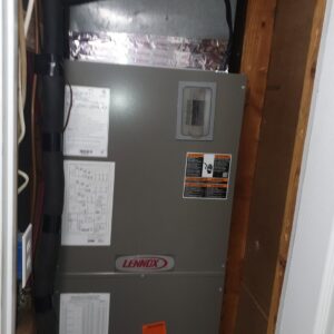 A Lennox HVAC air handler unit installed in a utility closet by Home Shield Heating and Air in Shreveport, LA.