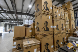 Stacks of Lennox HVAC equipment boxes in the warehouse of Prudhom Mechanical LLC in Edmond, OK