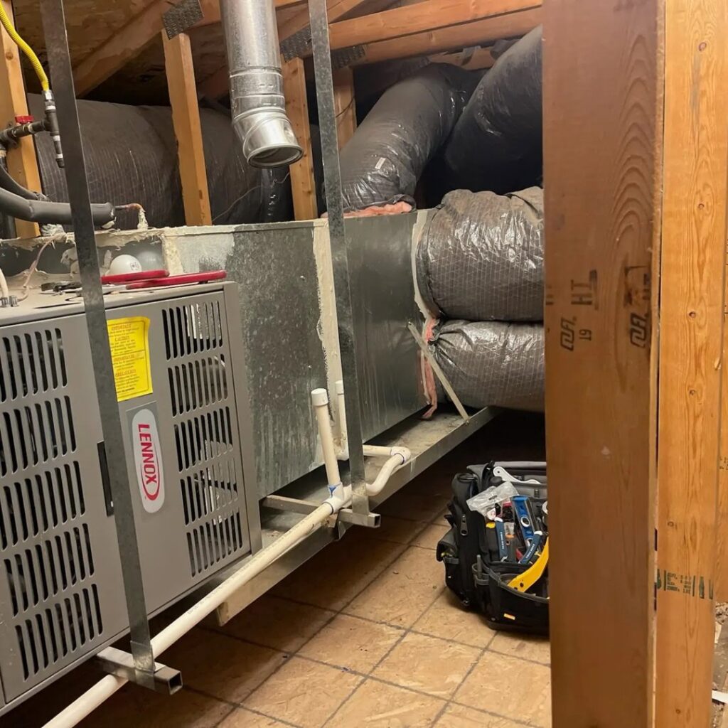 A new Lennox HVAC system installation with ductwork in an attic by J & M Cooling & Heating LLC in Peoria, AZ.