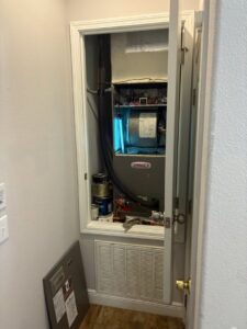 A Lennox indoor air handler unit installed in a closet by Timely Air Conditioning in Riverview, FL.