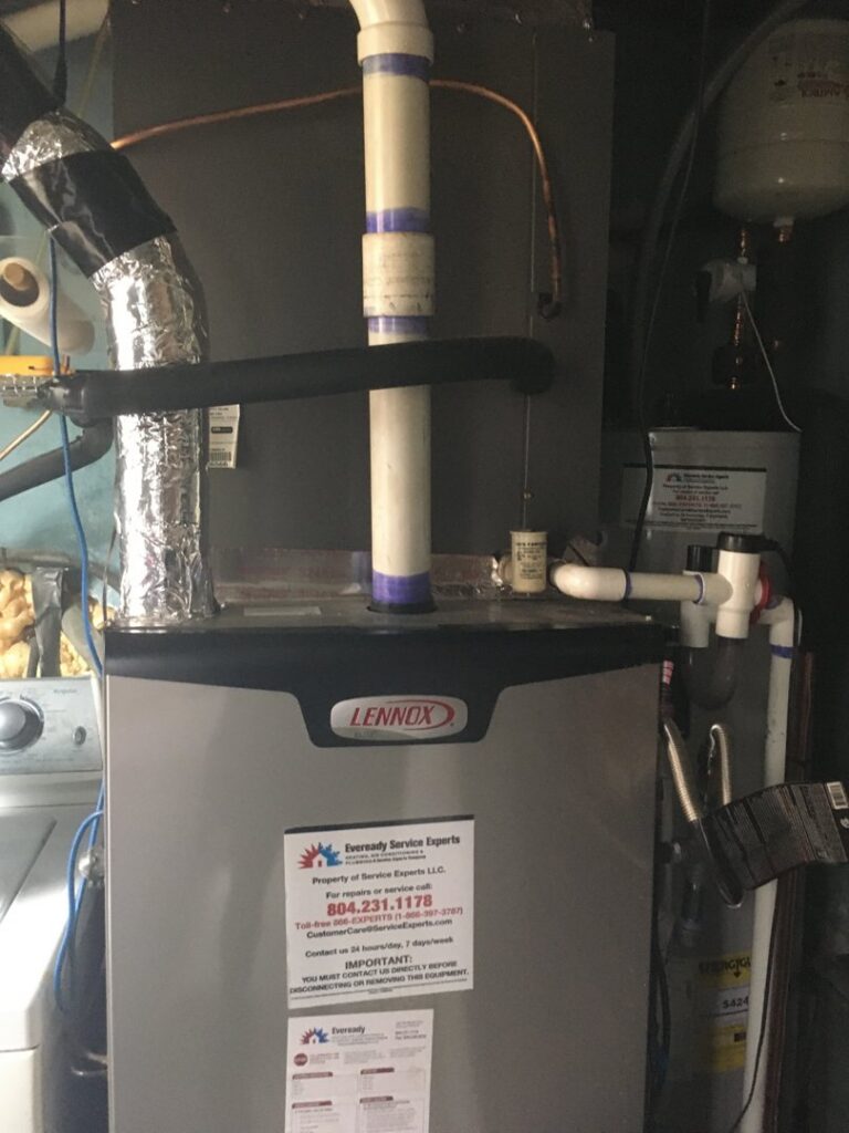 An indoor Lennox HVAC unit with an Eveready Service Experts sticker in Henrico, VA.