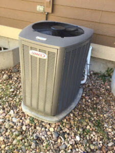 A Lennox outdoor air conditioning unit installed outside a home by Waymaker HVAC LLC in Colorado Springs, CO.