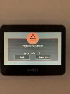 A Lennox thermostat displaying a critical error message serviced by BC Express Inc Heating & Air Conditioning in Toms River, NJ.