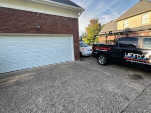 Lenny's Garage Door truck parked at a residential property for a service job in Louisville, KY.