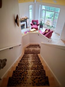 A stylish leopard print carpet stair runner installed by Vogel's Carpet & Flooring in Seattle, WA