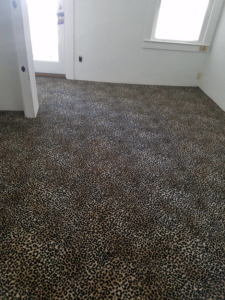 A room showcasing a unique leopard print carpet installation completed by A Floor For You in Denver, CO.