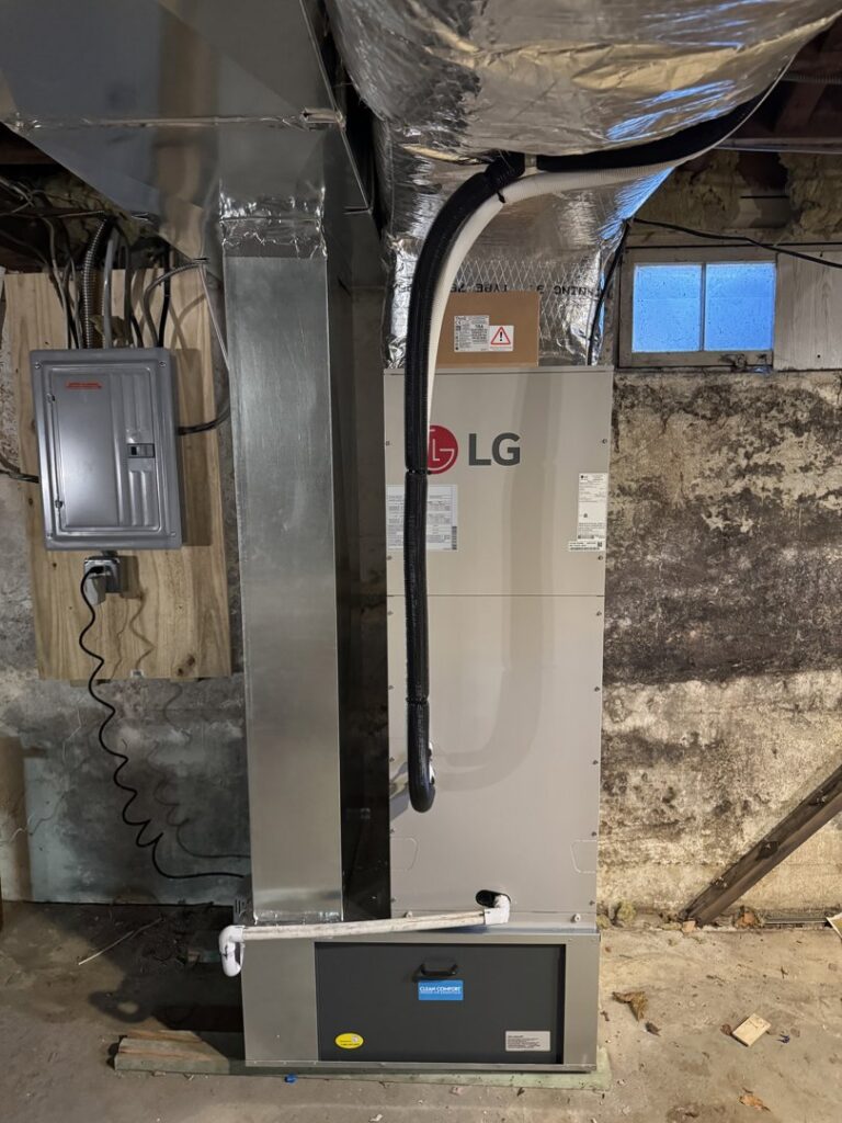 An LG air handler unit and ductwork installed in a basement by Ferreira Mechanical, LLC in Fall River, MA
