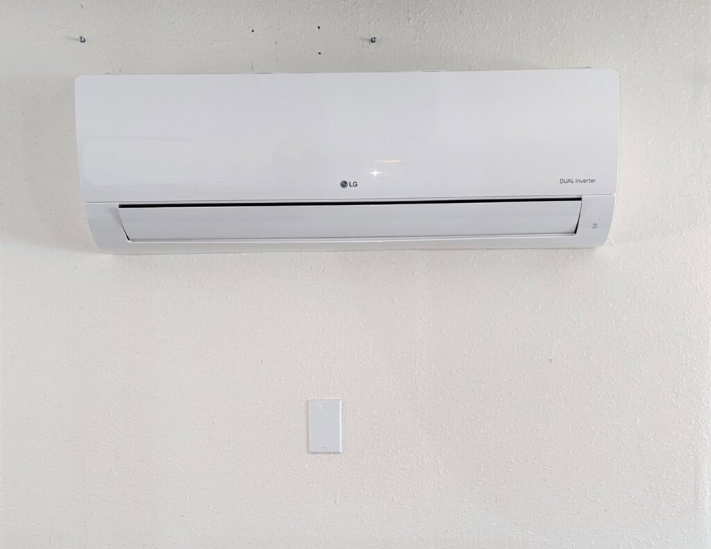 An LG Dual Inverter indoor mini-split HVAC unit installed on a wall by Raytech Refrigeration, Heating & Cooling in Alamogordo, NM.