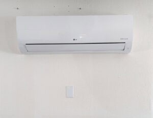 An LG Dual Inverter indoor mini-split HVAC unit installed on a wall by Raytech Refrigeration, Heating & Cooling in Alamogordo, NM.