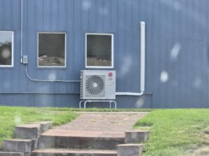 LG mini-split outdoor condenser unit installed on a stand by Maddog Contracting LLC in Post Falls, ID.