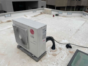 An LG Smart Inverter HVAC outdoor unit installed on a rooftop by Number 1 Plumber in Washington, DC.
