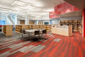 A modern library interior featuring stylish patterned carpet tiles installed by Capital Carpet & Flooring Specialists in Wilmington, MA