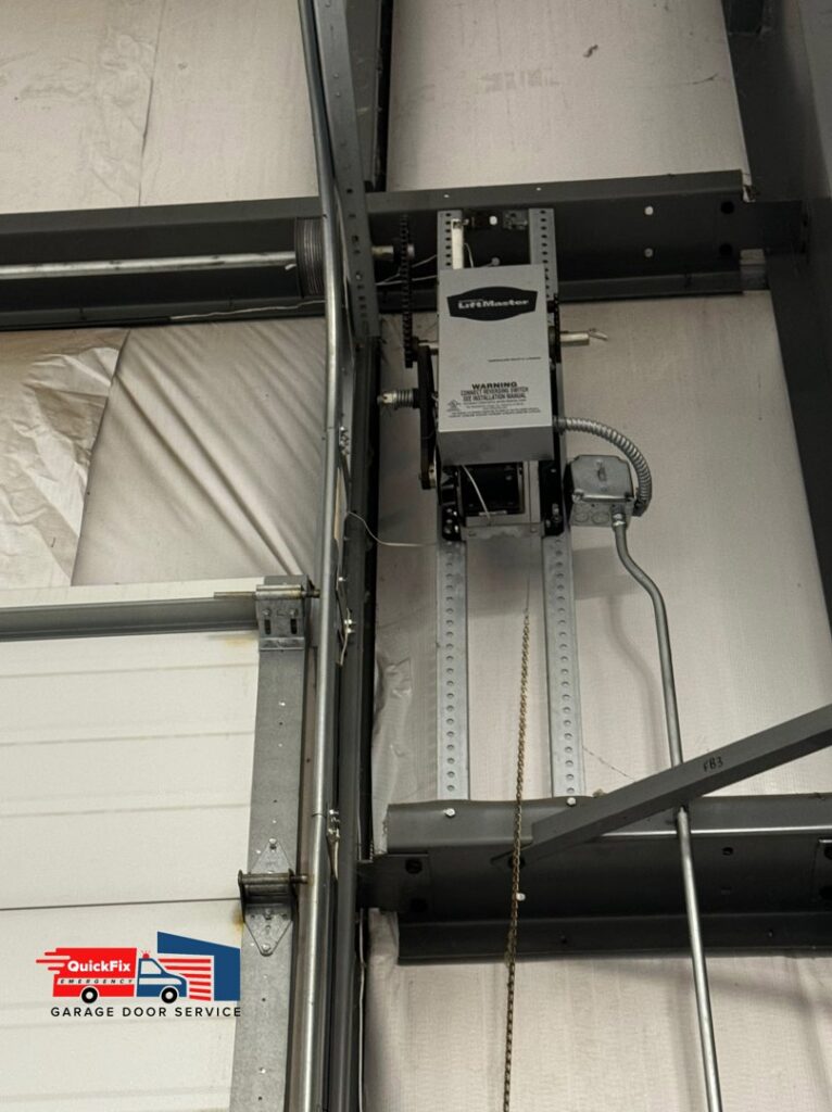 A close-up of a LiftMaster commercial garage door opener and its chain drive system installed by QuickFix Garage Door Service in Brighton, MA.