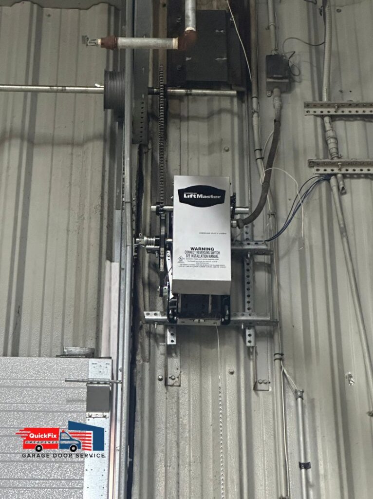 A detailed view of a LiftMaster commercial garage door opener system installed by QuickFix Garage Door Service in Brighton, MA.