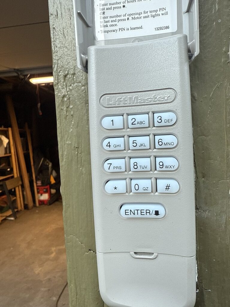 A LiftMaster garage door keypad, professionally installed for convenient access by Rainier Garage Door in Bellevue, WA.