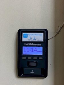 A close-up of a LiftMaster garage door opener control panel installed by Access Garage Doors-Chattanooga, TN