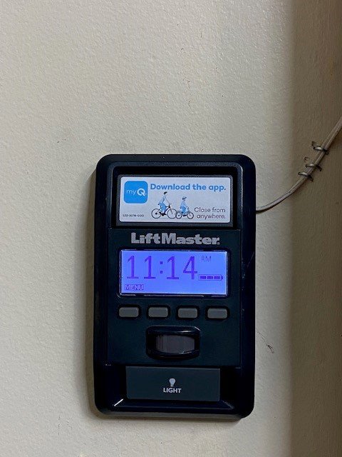 A close-up of a LiftMaster garage door opener control panel installed by Access Garage Doors-Chattanooga, TN