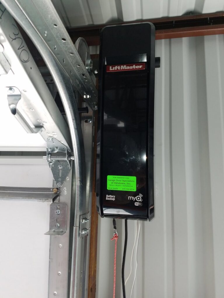 A LiftMaster garage door opener and track system installed by Garage Door Specialists Of Oklahoma Inc. in Oklahoma City, OK