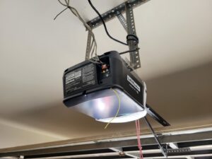 A LiftMaster garage door opener installed on a ceiling, showing a typical installation by Gryffin Garage Door in Chandler, AZ