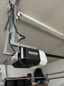 A close-up of a LiftMaster garage door opener motor and rail system installed by SCI Door in Yakima, WA