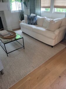 A clean, light-colored area rug in a living room by JP Carpet Cleaning Expert Floor Care in Granada Hills, CA