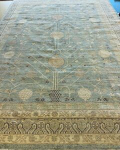 A beautiful light blue area rug featuring a tree-of-life pattern, offered by Yas Rugs in Lexington, KY.