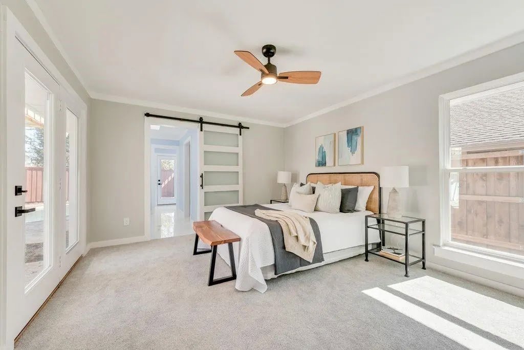 A light gray carpet installation in a bedroom by Texas Tuff Floors in Dallas, TX