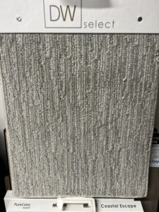 A close-up of a light gray striped carpet sample at West Michigan Flooring & Interiors in Byron Center, MI.