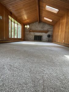 Newly installed light grey carpet in a large room by CAP Flooring in Buffalo, NY