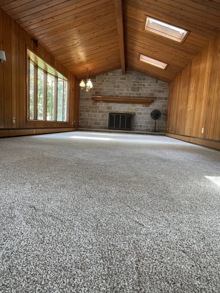Newly installed light grey carpet in a large room by CAP Flooring in Buffalo, NY