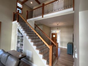 A newly installed light grey carpet on a residential staircase by On Point Flooring in Concord, NC