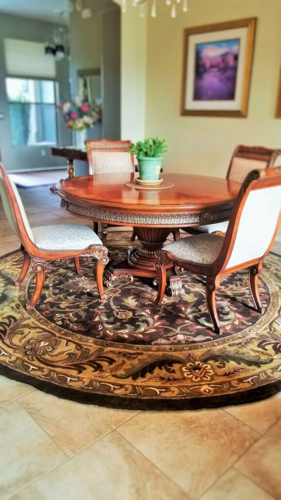 A light-colored patterned area rug with detailed close-ups, available at Ebie's Rug Cache & Ebie's Rug Cleaning in Tucson, AZ