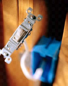 A new light switch being installed by an electrician from Agape Electric in Kenai, AK.