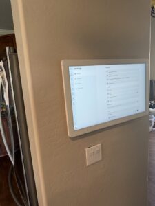 Light switch and wall-mounted smart home tablet installed by Silo Electric in Gilbert, AZ