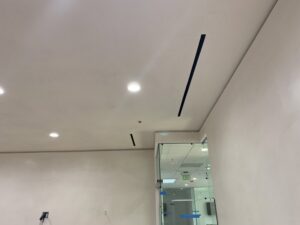 Modern linear air diffusers installed in a ceiling as part of an HVAC system by 20th Century Heating and Air in Anaheim, CA.