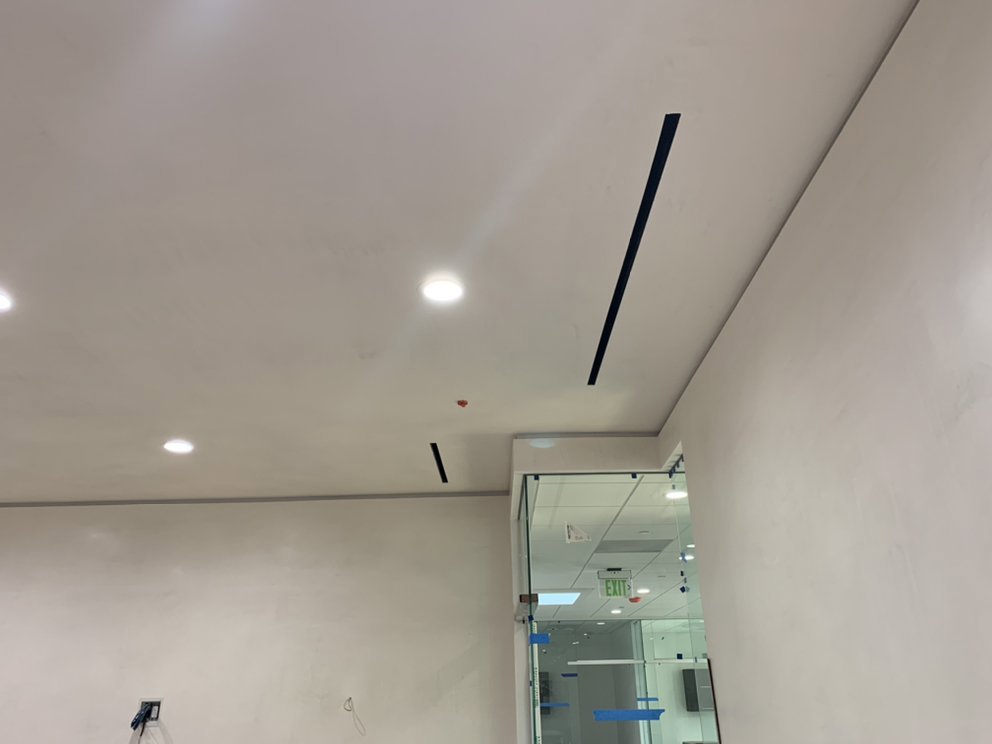 Modern linear air diffusers installed in a ceiling as part of an HVAC system by 20th Century Heating and Air in Anaheim, CA.