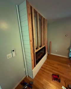 A linear electric fireplace installation in progress by Greer Enterprises in Raymond, NH.