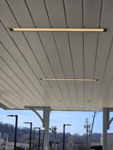 Linear LED lighting fixtures installed on a ceiling, showcasing commercial lighting work by Apex Electric LLC in Brea, CA.